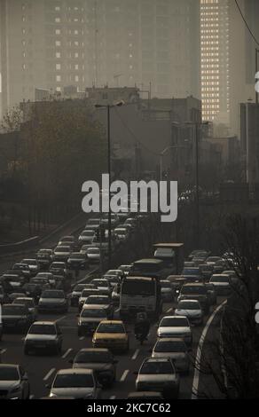 Vehicles travel on a road in northern Tehran during a polluted air, following the COVID-19 outbreak in Iran, on January 12, 2021. Tehran is wedged between mountains and dirty air can get trapped when there is no wind or rain. Iranian health experts say thousands of deaths a year are caused by heart attacks and respiratory illnesses brought on by smog. (Photo by Morteza Nikoubazl/NurPhoto) Stock Photo