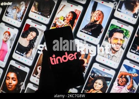 Tinder app logo is displayed on a mobile phone screen photographed on Tinder website background. Krakow, Poland on January 15, 2021. Numbers show that the Covid-19 pandemic resulted in an increase in people looking for love online on dating apps and websites. (Photo illustration by Beata Zawrzel/NurPhoto) Stock Photo