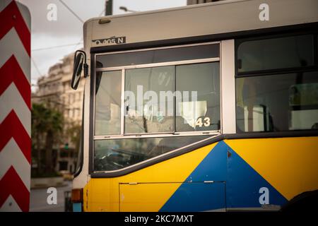 The driver of an empty public bus during a cold day in Athens, Greece, on January 16, 2021. (Photo by Maria Chourdari/NurPhoto) Stock Photo