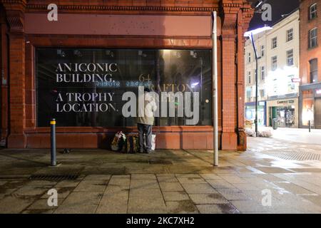 A man is packing all goods he just received from a group of volunteers from the Homeless Mobile Run outside Dunnes Stores on Grafton Street, Dublin, during Level 5 Covid-19 lockdown. On Wednesday, 20 January, 2021, in Dublin, Ireland. (Photo by Artur Widak/NurPhoto) Stock Photo