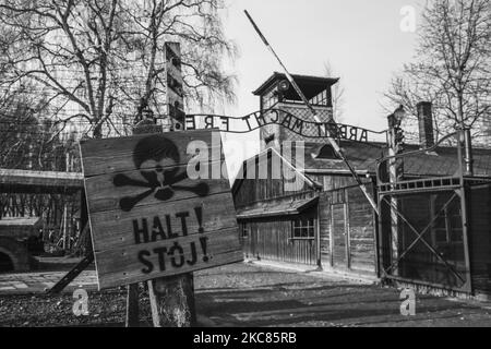 (EDITOR'S NOTE: Image was converted to black and white) The 'Halt' sign by the 'Arbeit Macht Frei' entrance gate at the former Nazi German Auschwitz I concentration and extermination camp in Oswiecim, Poland on January 26, 2020. (Photo by Beata Zawrzel/NurPhoto) Stock Photo