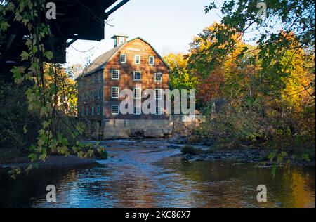 Old mill by the Raritan River next to abandoned railroad bridge at historic district of Neshanic Station, New Jersey, USA -02 Stock Photo
