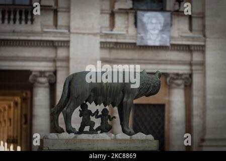 A portrait of the Egyptian student and activist Patrick Zaki, detained in Cairo since February 2020, hangs on from the facade of Palazzo Nuovo in Piazza del Campidoglio, seat of Rome's town hall, as the Capitoline She-wolf is seen at bottom, in Rome, Italy, on January 25, 2021. (Photo by Andrea Ronchini/NurPhoto) Stock Photo