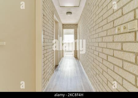 Light, narrow, hallway, many, doors, white, walls, glowing, lamp Stock Photo