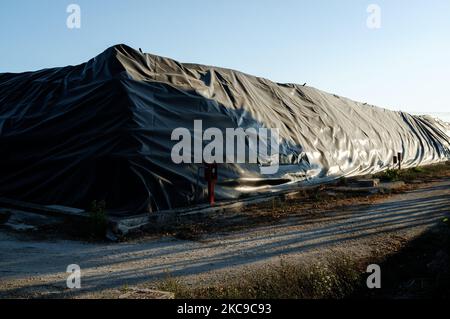 This photograph, taken on 15 August 2019, shows the 'Taverna del Ré' repository for Ecobale located between the border of Giugliano in Campania (Naples) and Villa Literno (Caserta) in the middle of the Lands of Fires 'Terra dei Fuochi'. It is one of the largest storage sites in Campania for its 130 hectares with about 6 million Ecobale inside. The 'Lands of Fires' is an area of the Campania region located between Naples and Caserta, reported as such by toxic waste fires and the ignition of waste fires that have had a strong impact on the health of the local population. The Public Prosecutor's  Stock Photo