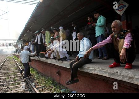 Farmers block train services as a part of their ongoing protest against farm laws, at Modi Nagar railway station in Ghaziabad, Uttar Pradesh, India on February 18, 2021. Thousands of protesting farmers blocked trains by sitting on railway tracks in parts of northern India to amplify their demand for the repeal of new farm laws that have triggered months of massive protests. (Photo by Mayank Makhija/NurPhoto) Stock Photo