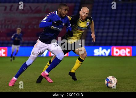 Oldham Athletic's Dylan Bahamboula tussles with Jason Taylor of Barrow during the Sky Bet League 2 match between Oldham Athletic and Barrow at Boundary Park, Oldham on Tuesday 23rd February 2021. (Credit: Eddie Garvey | MI News) (Photo by MI News/NurPhoto) Stock Photo