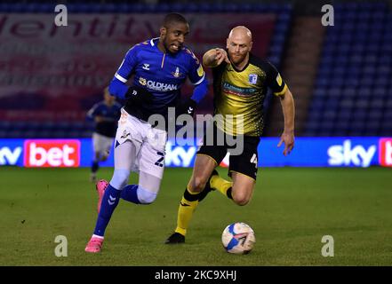 Oldham Athletic's Dylan Bahamboula tussles with Jason Taylor of Barrow during the Sky Bet League 2 match between Oldham Athletic and Barrow at Boundary Park, Oldham on Tuesday 23rd February 2021. (Credit: Eddie Garvey | MI News) (Photo by MI News/NurPhoto) Stock Photo
