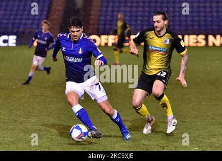 Oldham Athletic's George Blackwood tussles with Oliver Banks of Barrow during the Sky Bet League 2 match between Oldham Athletic and Barrow at Boundary Park, Oldham on Tuesday 23rd February 2021. (Credit: Eddie Garvey | MI News) (Photo by MI News/NurPhoto) Stock Photo