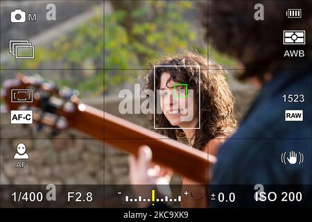 Screen or camera viewfinder with the photographic settings of a portrait photo Stock Photo