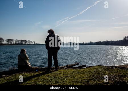 A couple is taking a break to enjoy the good weather, during the first weekend of warmer temperatures, in The Netherlands, on February 20th, 2021. (Photo by Romy Arroyo Fernandez/NurPhoto) Stock Photo