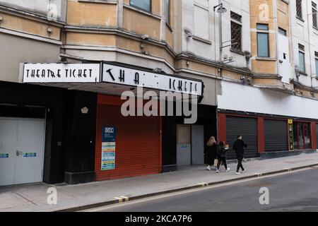 LONDON, UNITED KINGDOM - MARCH 02, 2021: People walk past a shuttered theatre ticket shop in central London as England remains under third lockdown to reduce the number of Covid-19 infections, on 02 March, 2021 in London, England. Chancellor Rishi Sunak is due to announce his tax and spending plans in 2021 Budget tomorrow with the main focus on measures to support the UK's economic recovery from the slump caused by the coronavirus pandemic including a £5bn scheme for High Street shops and hospitality businesses as well as £408m for museums, theatres and galleries. (Photo by WIktor Szymanowicz/ Stock Photo