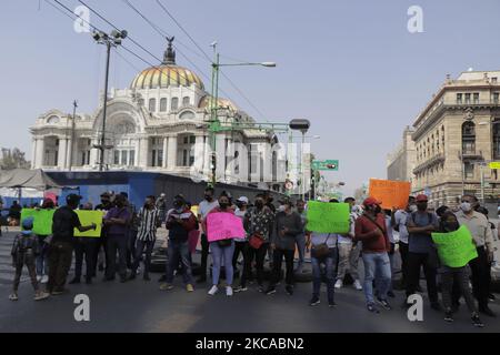 Merchants and alleged neighbors of the Historic Center of Mexico City, demonstrated on Eje Central and Juarez Avenue during the COVID-19 health emergency and the orange epidemiological traffic light, to demand the eviction of members of the Indigenous Artisan Movement and the Triqui community who maintain a sit-in in the area and who request the intervention of federal authorities and the National Guard after being victims of forced displacement in the state of Oaxaca in the area of Tierra Blanca, Copala, Oaxaca. The protesters stated that the sit-in set up by these indigenous communities affe Stock Photo