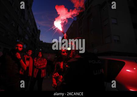 A Police arrests a supporter that lighted a sparkler in the street during the UEFA Europa League Round of 16 Leg One match between Granada CF and Molde FK at Nuevo Los Carmenes Stadium on March 11, 2021 in Granada, Spain. Football stadiums in Spain remain closed to fans due to the Coronavirus Pandemic. (Photo by Álex Cámara/NurPhoto) Stock Photo