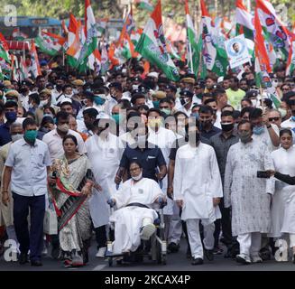 West Bengal Chief Minister & Trinamool Congress (TMC) Supremo Mamata Banerjee starting her first public event of election campaign , as she led a road show in a wheelchair in Kolkata, India on Sunday , 14th March , 2021. 66-year-old Trinamool Congress (TMC) Supremo Mamata Banerjee was injured while campaigning in Nandigram. (Photo by Sonali Pal Chaudhury/NurPhoto) Stock Photo