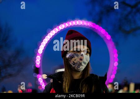 Protestor outside of New Scotland Yard, the headquarters of the Metropolitan Police during a protest in Parliament Square against the The Police, Crime, Sentencing and Courts Bill and criticising the actions of the police at Saturday night's vigil in London, Britain, 15 March 2021. Hundreds of people turned out at Clapham Common on Saturday night to pay tribute to Sarah Everard, a 33-year-old London resident whose kidnapping and death - allegedly at the hands of an off-duty Metropolitan Police officer - prompted a wave of concern over women's safety. The same police force is being criticised f Stock Photo