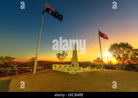 Anzac Hill War Memorial with Australia flags flying, most visited landmark in Alice Springs, Northern Territory, Central Australia. The lookout offers Stock Photo
