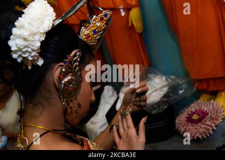 Paimpath Traditional Kandyan dancers prepare backstage before participating in ...