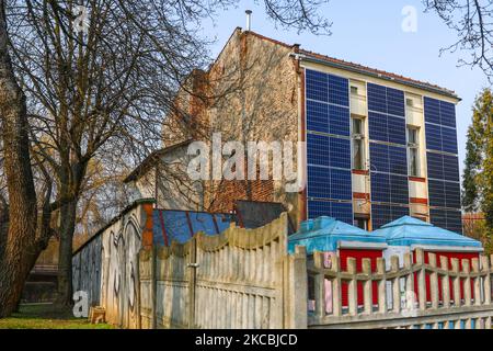 A number of solar collector panels are attached to the front wall of an old house in the center of Krakow, Poland on March 26, 2021. The recent boom in solar energy has been fuelled in part by photovoltaic micro-installations on people’s homes, supported by a successful state subsidy scheme. The development comes as the government seeks to gradually transition away from reliance on coal, with renewables playing an ever larger role in the country’s energy mix. (Photo by Beata Zawrzel/NurPhoto) Stock Photo