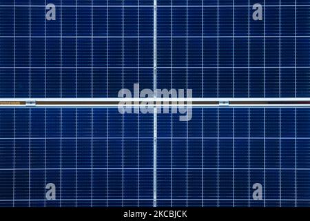 A number of solar collector panels are attached to the front wall of an old house in the center of Krakow, Poland on March 26, 2021. The recent boom in solar energy has been fuelled in part by photovoltaic micro-installations on people’s homes, supported by a successful state subsidy scheme. The development comes as the government seeks to gradually transition away from reliance on coal, with renewables playing an ever larger role in the country’s energy mix. (Photo by Beata Zawrzel/NurPhoto) Stock Photo