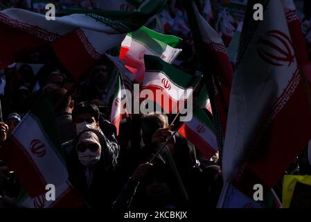 Tehran, Iran. 04th Nov, 2022. A woman waves the Iranian flags during a demonstration in front of the former U.S. Embassy in Tehran, Iran, Friday, Nov. 4, 2022. Iran on Friday marked the 1979 takeover of the U.S. Embassy in Tehran as its theocracy faces nationwide protests after the death of a 22-year-old woman earlier arrested by the country's morality police. (Photo by Sobhan Farajvan/Pacific Press) Credit: Pacific Press Media Production Corp./Alamy Live News Stock Photo