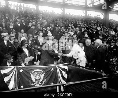 President Herbert Hoover receiving a baseball from Walter Johnson, who played for the Washington Senators, 1931. Stock Photo