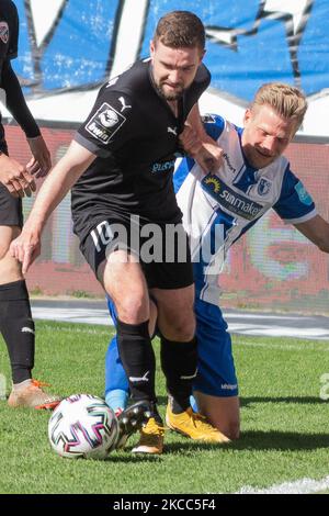 Dominik Ernst (right) of Magdeburg and Marc Stendera (left) of Ingolstadt battle for the ball during the 3. Liga match between 1. FC Magdeburg and FC Ingolstadt 04 at MDCC-Arena on April 03, 2021 in Magdeburg, Germany. (Photo by Peter Niedung/NurPhoto) Stock Photo