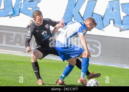 Dominik Ernst (right) of Magdeburg and Marcel Gaus of Ingolstadt (left) battle for the ball during the 3. Liga match between 1. FC Magdeburg and FC Ingolstadt 04 at MDCC-Arena on April 03, 2021 in Magdeburg, Germany. (Photo by Peter Niedung/NurPhoto) Stock Photo