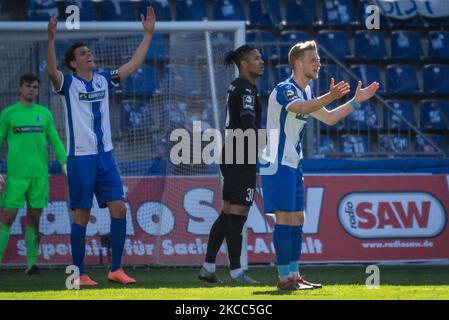 Tobias Mueller (left) and Dominik Ernst (right) of Magdeburg reacts during the 3. Liga match between 1. FC Magdeburg and FC Ingolstadt 04 at MDCC-Arena on April 03, 2021 in Magdeburg, Germany. (Photo by Peter Niedung/NurPhoto) Stock Photo