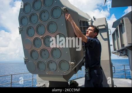 Fire Controlman performs maintenance on a rolling airframe missile system. Stock Photo