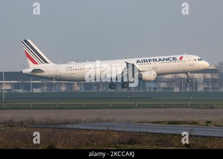 Air France Airbus A321 aircraft as seen flying on final approach for landing at Amsterdam Schiphol Airport AMS EHAM during a misty weather morning. The A321-200 airplane has the registration F-GTAD and is powered by 2x CFMI jet engines. Air France AIRFRANCE AFR is the flag carrier of France, a subsidiary of Air France-KLM Group member of SkyTeam aviation alliance group with the main hub at Charles de Gaulle Airport. According to local and international media in April 2021, the French government will inject up to 4 billion Euro to the airline, with the French state becoming the largest sharehol Stock Photo