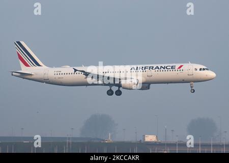 Air France Airbus A321 aircraft as seen flying on final approach for landing at Amsterdam Schiphol Airport AMS EHAM during a misty weather morning. The A321-200 airplane has the registration F-GTAD and is powered by 2x CFMI jet engines. Air France AIRFRANCE AFR is the flag carrier of France, a subsidiary of Air France-KLM Group member of SkyTeam aviation alliance group with the main hub at Charles de Gaulle Airport. According to local and international media in April 2021, the French government will inject up to 4 billion Euro to the airline, with the French state becoming the largest sharehol Stock Photo