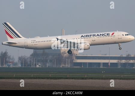 Air France Airbus A321 aircraft as seen flying on final approach for landing at Amsterdam Schiphol Airport AMS EHAM during a misty weather morning. The A321-200 airplane has the registration F-GTAD and is powered by 2x CFMI jet engines. Air France AIRFRANCE AFR is the flag carrier of France, a subsidiary of Air France-KLM Group member of SkyTeam aviation alliance group with the main hub at Charles de Gaulle Airport. According to local and international media in April 2021, the French government will inject up to 4 billion Euro to the airline, with the French state becoming the largest sharehol Stock Photo