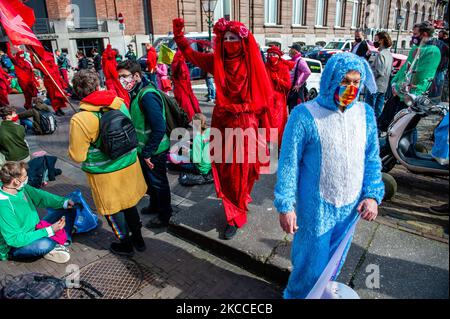 The Red Rebels are walking through the activists, during the massive disruptive action carried out by Extinction Rebellion, on April 9th in The Hague. (Photo by Romy Arroyo Fernandez/NurPhoto) Stock Photo