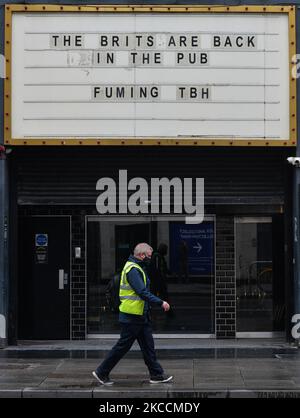 An uplifting notice on the message board reading 'The Brits are back in the pub... Fuming TBH' seen outside the Academy building in Dublin city center during the COVID-19 lockdown. On Monday, 12 April 2021, in Dublin, Ireland. (Photo by Artur Widak/NurPhoto) Stock Photo