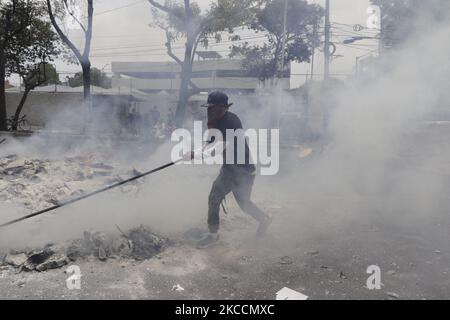 Members of the Otomí community in Mexico City, Mexico on April 12, 2021 burned the archives of the National Institute of Indigenous Peoples on the sixth month anniversary of their occupation of its facilities as an act of repudiation of paramilitary attacks and counterinsurgency warfare against the National Liberation Army (EZLN) and Zapatista communities, the dispossession of their lands for megaprojects, as well as against the peoples and communities belonging to the National Indigenous Congress and the Indigenous Council of Government, whose demands to date have not been met by Mexican gove Stock Photo