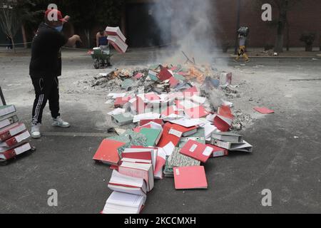 Members of the Otomí community in Mexico City, Mexico on April 12, 2021 burned the archives of the National Institute of Indigenous Peoples on the sixth month anniversary of their occupation of its facilities as an act of repudiation of paramilitary attacks and counterinsurgency warfare against the National Liberation Army (EZLN) and Zapatista communities, the dispossession of their lands for megaprojects, as well as against the peoples and communities belonging to the National Indigenous Congress and the Indigenous Council of Government, whose demands to date have not been met by Mexican gove Stock Photo