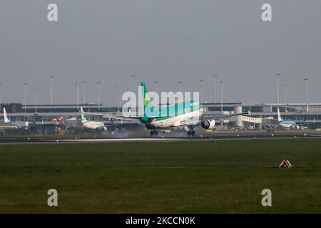 Aer Lingus Airbus A320 aircraft as seen flying on final approach and landing at Amsterdam Schiphol International Airport in the Netherlands. The airplane has the registration EI-DVI and the name St Emere / Eimear while is powered by 2x CFMI jet engines. The airline is the flag carrier of Ireland with a hub in Dublin Airport. The world aviation passenger traffic numbers declined due to the travel restrictions, safety measures such as lockdowns, quarantine etc during the era of the Covid-19 Coronavirus pandemic that hit hard the aviation and travel industry. Amsterdam, Netherlands on April 1, 20 Stock Photo