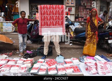 Vendor selling Assamese Traditional Gamosa, on the occasion of Rongali Bihu Festival, in Guwahati, India on 13 April 2021. (Photo by David Talukdar/NurPhoto) Stock Photo