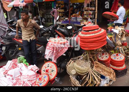 Vendor selling Assamese Traditional Gamosa and Japi on the occasion of Rongali Bihu Festival, in Guwahati, India on 13 April 2021. (Photo by David Talukdar/NurPhoto) Stock Photo