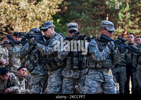 U.S. soldiers show Ukranian Marines proper procedures and techniques. Stock Photo