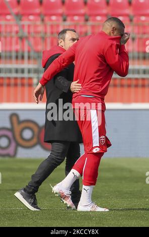 Cristian Brocchi (L) head coach of AC Monza and Kevin-Prince Boateng (R) talk at end of the Serie B match between AC Monza and US Cremonese at Stadio Brianteo on April 17, 2021 in Monza, Italy. (Photo by Giuseppe Cottini/NurPhoto) Stock Photo