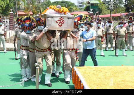 Assam police personnel carry the mortal remains of Â former Assam Chief Minister Bhumidhar Barman, during his funeral procession, in Guwahati, India Monday, April 19, 2021 (Photo by Anuwar Hazarika/NurPhoto) Stock Photo