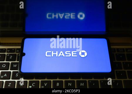 Chase bank logo is displayed on a mobile phone screen photographed for an illustration photo in Gliwice, Poland on April 21, 2021. (Photo by Beata Zawrzel/NurPhoto) Stock Photo