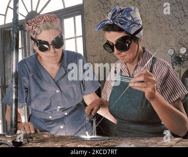Women welders in World War II, circa 1940's. Stock Photo