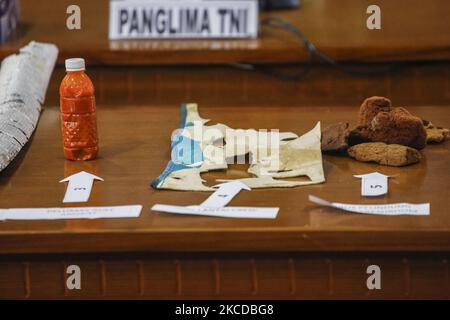 Grease oil bottle for periscope, crew floor mat and sponges seen as part of missing Indonesian navy submarine KRI Nanggala 402 displayed during press conference at Ngurah Rai Military Air Base in Kuta, Bali, Indonesia on April 24 2021. A military submarine reported missing in north of Bali sea during torpedo drill with 53 crews abroad since Wednesday 21 April 2021. The submarine stated from missing to sunk as evidenced being found. (Photo by Johanes Christo/NurPhoto) Stock Photo