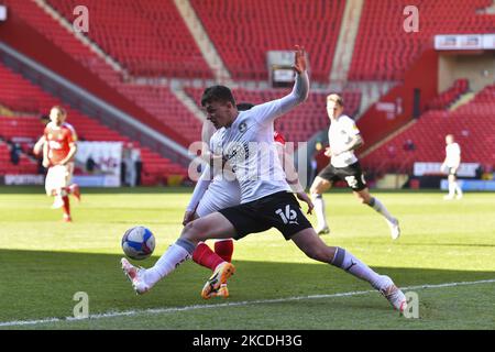 Harrison Burrows of Peterborough battles for possession with Conor Washington of Charlton Athletic during the Sky Bet League 1 match between Charlton Athletic and Peterborough at The Valley, London, England on 24th April 2021. (Photo by Ivan Yordanov/MI News/NurPhoto) Stock Photo