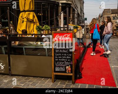 People are waiting in line to take a sit on a terrace, during the first day that stores and terraces allowed to open again with Corona measures, in Nijmegen, The Netherlands, on April 28th, 2021. (Photo by Romy Arroyo Fernandez/NurPhoto) Stock Photo