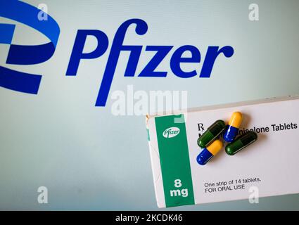 Medicine pills are seen with Pfizer logo in this illustration photo taken in Tehatta, West Bengal, India on 29 April 2021. New York-based Pharmaceutical Pfizer Inc. said that an oral drug for treating COVID-19 could be available by end of 2021. The Pharmaceutical company is currently working on two anti-viral drugs- one injectable, another oral. (Photo Illustration by Soumyabrata Roy/NurPhoto) Stock Photo