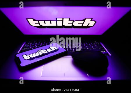 Twitch logos are seen displayed on a phone and a laptop screens in this illustration photo taken in Krakow, Poland on April 30, 2021. (Photo by Jakub Porzycki/NurPhoto) Stock Photo
